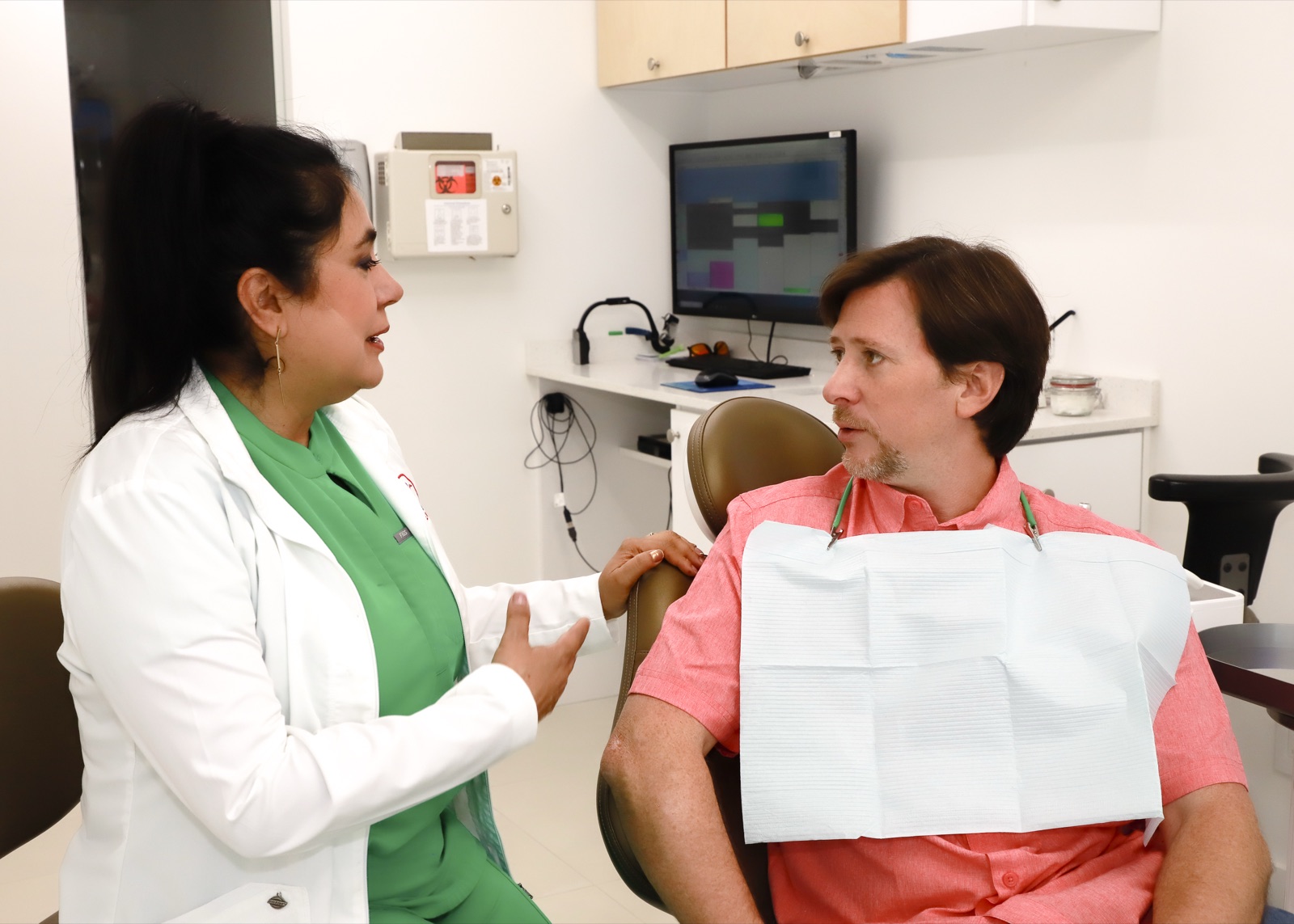 Dr. Cook talking with a patient